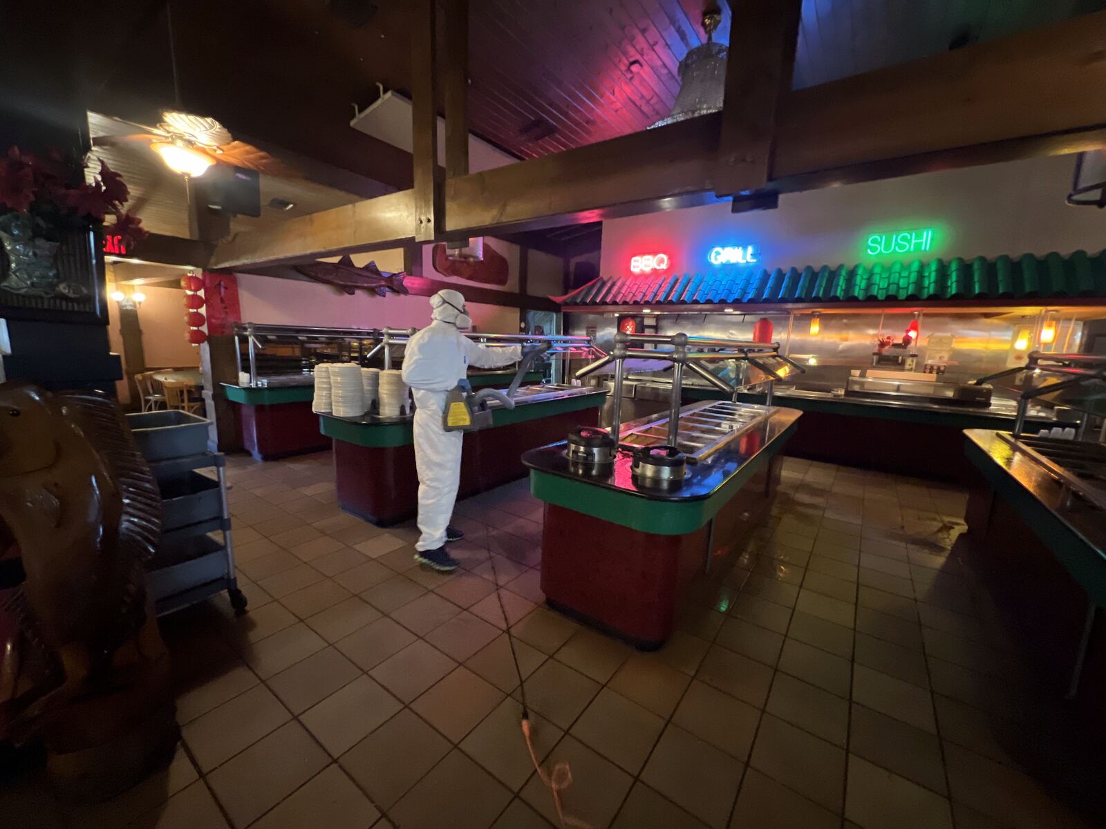 Technician working in commercial restaurant buffet area