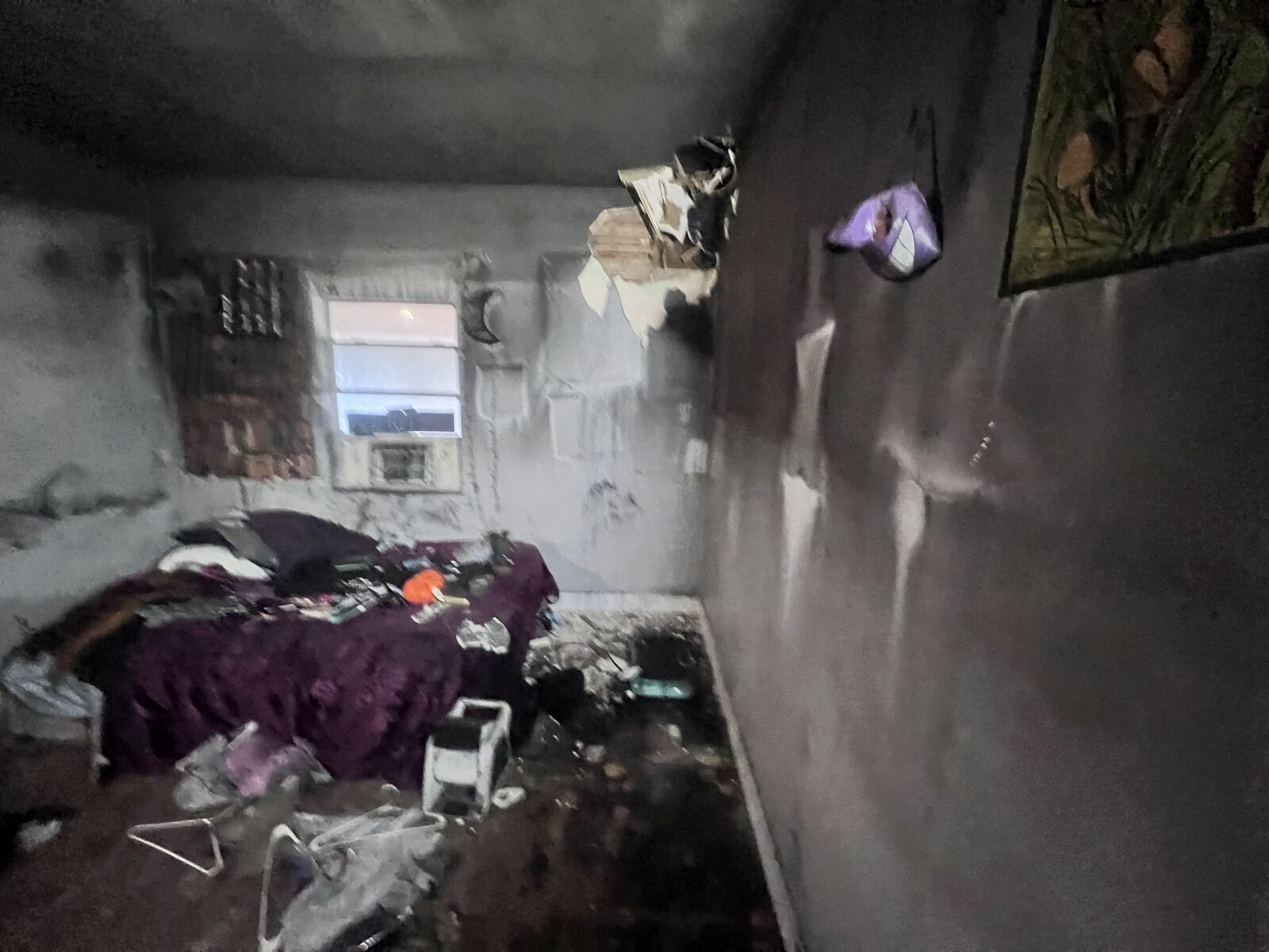 Fire-damaged bedroom before smoke and soot cleanup