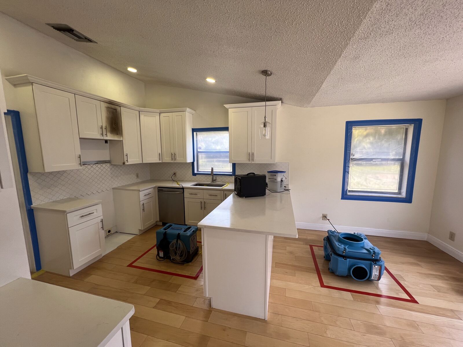 Kitchen restored with air treatment equipment completing the fire remediation
