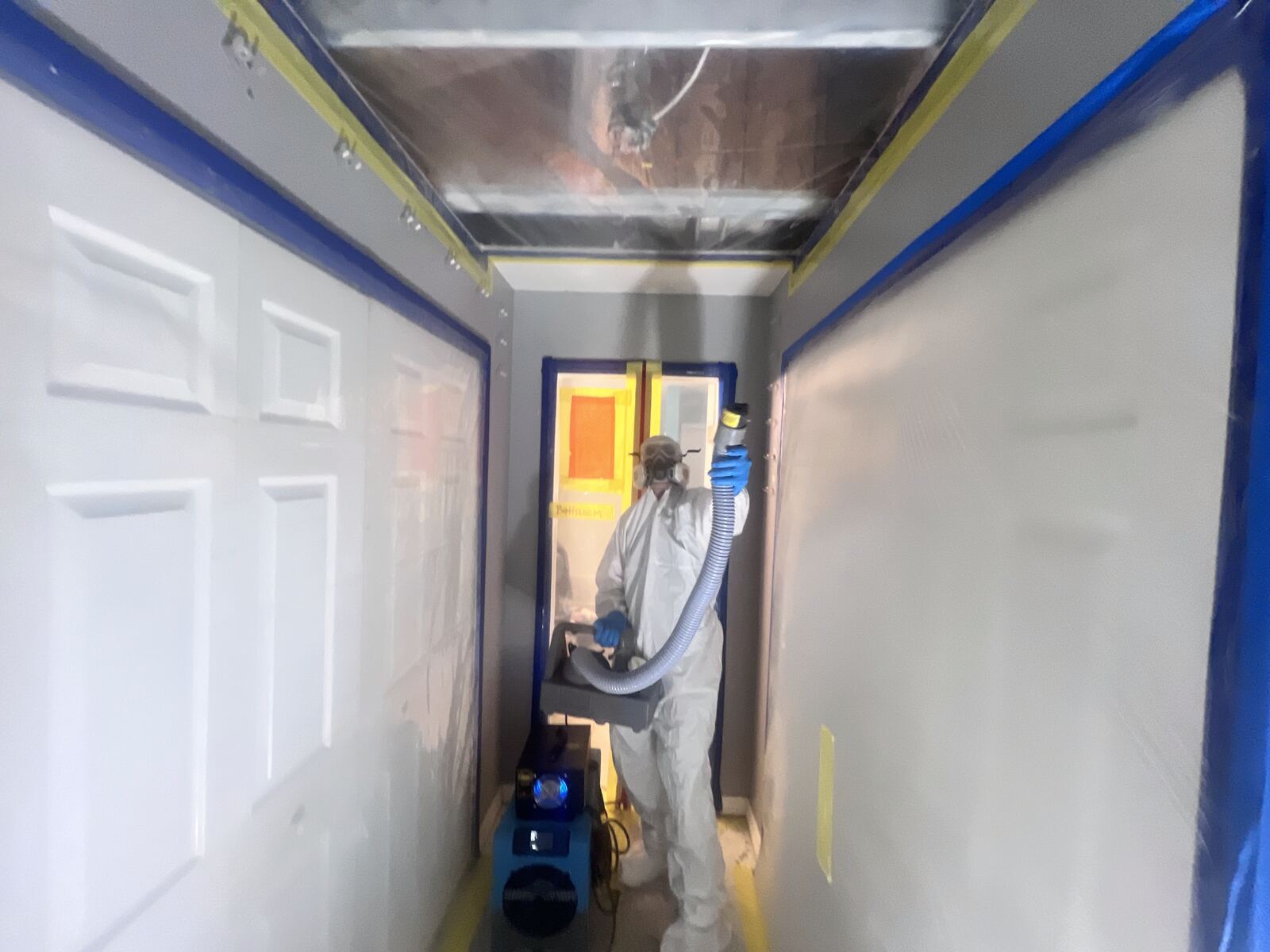 Containment and HEPA equipment set up during kitchen mold remediation