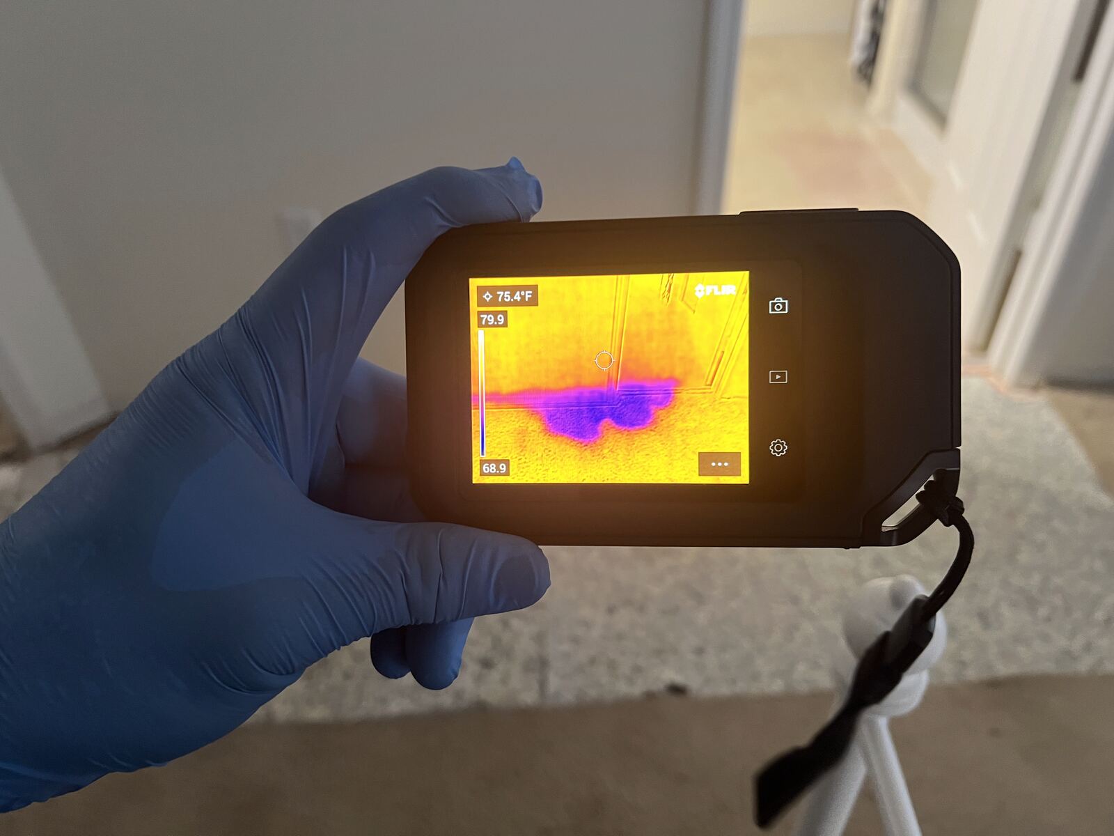 Thermal camera revealing hidden moisture in walls